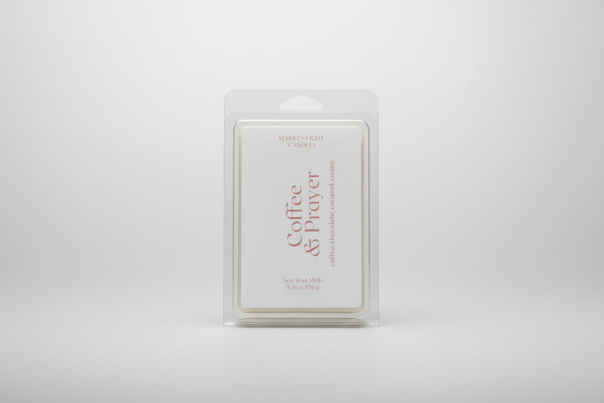 Picture of a plastic container with a whitle label reading Coffee & Prayer wax melt 5.5 oz 