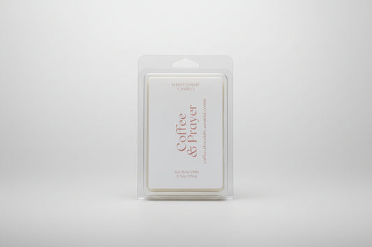 Picture of a plastic container with a whitle label reading Coffee & Prayer wax melt 5.5 oz 