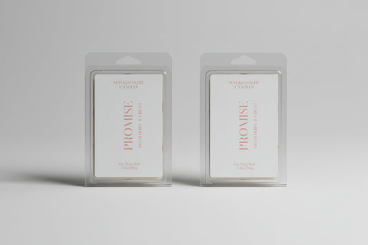 Two 'Promise' wax melt products in clear packaging on a dark surface