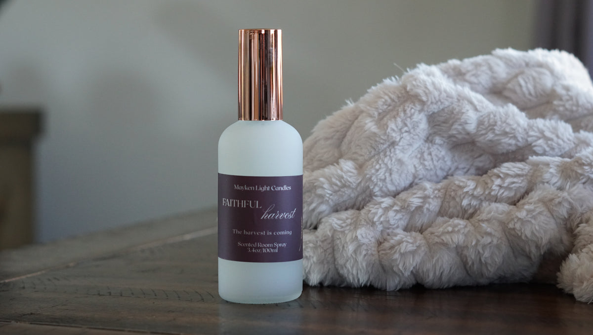 White Bottle with rose gold lid with a burgundy label showing Faithful Harvest 100 ml room spray