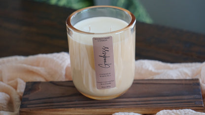 Candle with a label on a wooden board