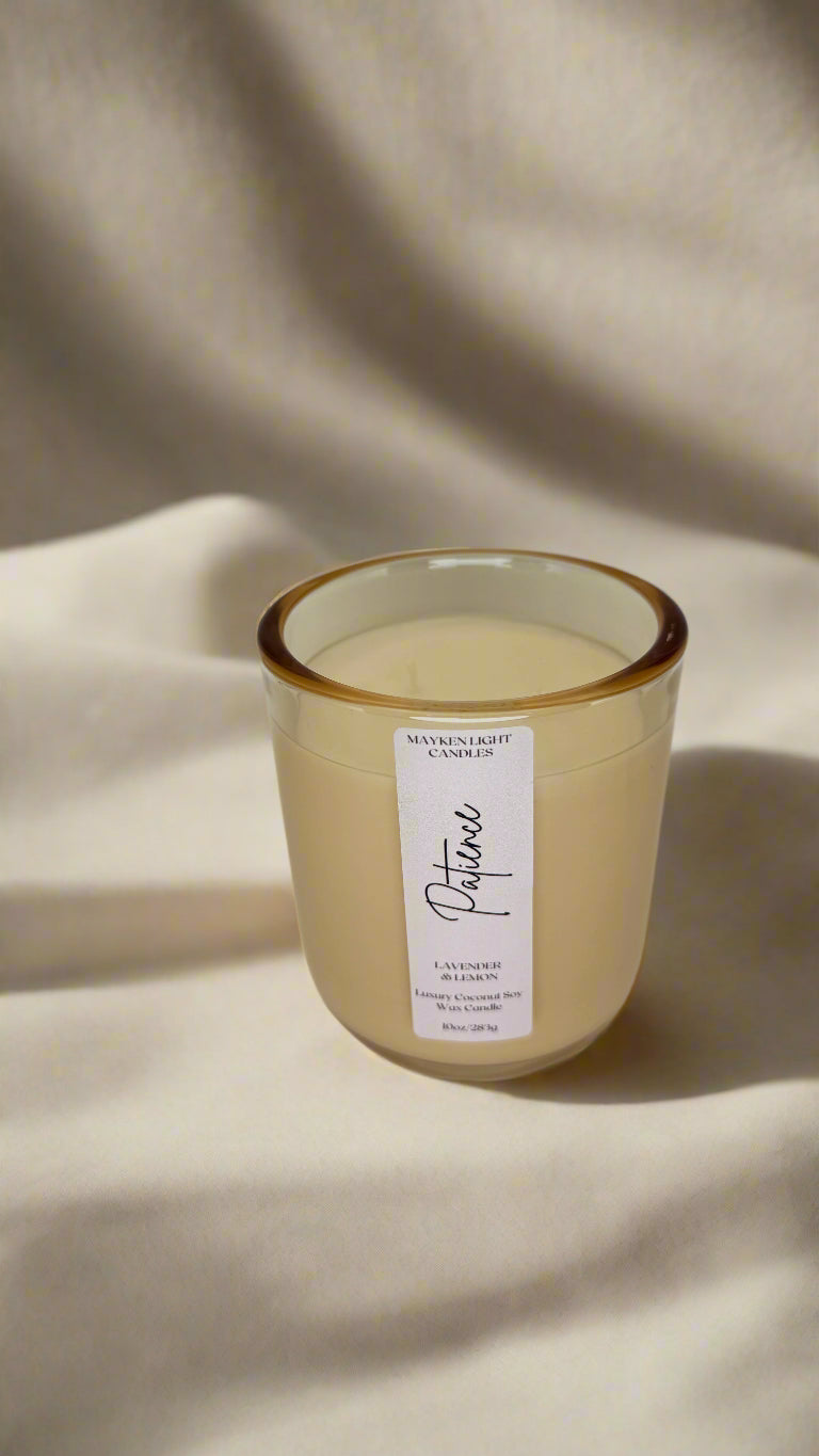 Candle with a label on a beige fabric background