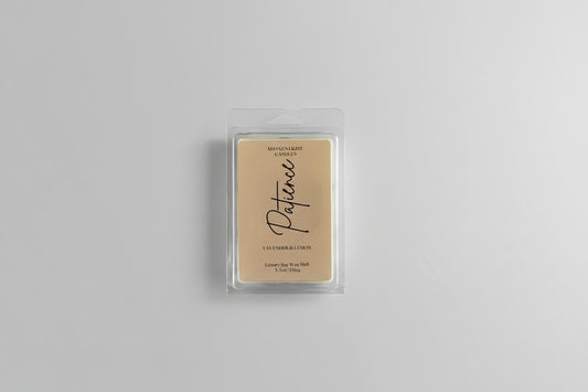 Picture of plastic wax melt container with a tan label reading Patience on a white background