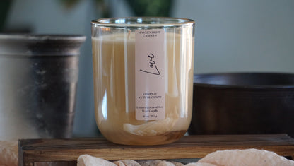 Candle with a label on a wooden surface